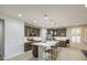 Modern kitchen featuring an island with pendant lighting and stainless steel appliances at 14413 W Dahlia Dr, Surprise, AZ 85379