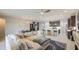 Inviting living room featuring a comfortable sectional sofa and a view into the kitchen at 14413 W Dahlia Dr, Surprise, AZ 85379