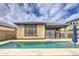 Backyard pool with travertine deck, and partial shade, near the outdoor covered seating at 14413 W Dahlia Dr, Surprise, AZ 85379