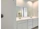 Bathroom showcasing a double sink vanity and a walk-in shower with sleek fixtures at 15585 W Williams St, Goodyear, AZ 85338