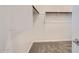 Walk-in closet with carpet and built-in shelving, offering ample storage space at 15585 W Williams St, Goodyear, AZ 85338