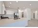 Modern kitchen featuring white cabinets, stainless steel appliances, quartz countertops, and a center island at 15585 W Williams St, Goodyear, AZ 85338