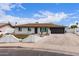 Charming single-story home features a manicured front yard, attached two-car garage, and inviting curb appeal at 1649 W Carmel Ave, Mesa, AZ 85202