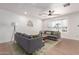 Bright living room with a large window, contemporary furnishings, and wood-style flooring at 1649 W Carmel Ave, Mesa, AZ 85202