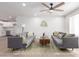 Spacious living room with modern furniture, ceiling fan, and a bright, inviting atmosphere at 1649 W Carmel Ave, Mesa, AZ 85202
