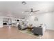 Bright and airy living room with modern decor, wood floors, and an open concept layout to the kitchen at 1649 W Carmel Ave, Mesa, AZ 85202