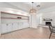 Bright living room showcases custom built-ins, modern lighting, and easy access to the fireplace at 1649 W Carmel Ave, Mesa, AZ 85202