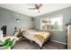 Cozy bedroom with natural light, a ceiling fan, and a desk space, perfect for work or study at 1825 S Spruce --, Mesa, AZ 85210