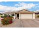 Charming single-story home with a two-car garage and colorful landscaping at 1825 S Spruce --, Mesa, AZ 85210