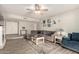 Spacious living room features a decorative fireplace and a large sectional sofa at 1825 S Spruce --, Mesa, AZ 85210