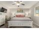 Comfortable main bedroom with a ceiling fan, decorative artwork and a window that lets in natural light at 1825 S Spruce --, Mesa, AZ 85210