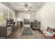 Bright office area features a desk, a sliding barn door detail, and a view to the kitchen at 1825 S Spruce --, Mesa, AZ 85210