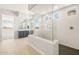 Stunning bathroom with an oversized shower, dual vanities, and a view of the bedroom at 18716 N 269Th Ln, Buckeye, AZ 85396