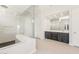 Elegant bathroom boasts a walk-in shower, sleek vanities, and contemporary finishes throughout at 18716 N 269Th Ln, Buckeye, AZ 85396