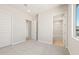 Neutral bedroom with carpet, adjacent doors leading to the bathroom and closet at 18716 N 269Th Ln, Buckeye, AZ 85396