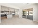 Open floor plan with kitchen island and sliding glass doors leading to covered patio at 18716 N 269Th Ln, Buckeye, AZ 85396