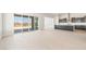 Open-concept layout with tile floors, kitchen view, and access to outdoor living at 18716 N 269Th Ln, Buckeye, AZ 85396