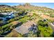 Aerial view of a park featuring a playground, basketball court, and walking paths at 1880 E Morten Ave # 242, Phoenix, AZ 85020