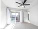 The carpeted bedroom is bright with a sliding door to the outside balcony at 1880 E Morten Ave # 242, Phoenix, AZ 85020