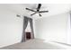 Bright bedroom features carpet, a ceiling fan, and a small bathroom area at 1880 E Morten Ave # 242, Phoenix, AZ 85020