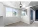 Bright dining area with modern light fixture and large windows for natural light at 1880 E Morten Ave # 242, Phoenix, AZ 85020