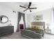 Relaxing bedroom with a ceiling fan, dresser, mirror and ensuite bathroom access at 1880 E Morten Ave # 242, Phoenix, AZ 85020