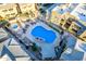 Aerial view of a community pool with lounge chairs, mature landscaping, and manicured walkways at 1880 E Morten Ave # 242, Phoenix, AZ 85020