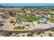 Stunning aerial view of a sprawling estate featuring a sparkling pool, ample parking, and lush landscaping in a peaceful setting at 19535 E Via De Olivos Rd, Queen Creek, AZ 85142