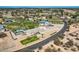Charming home boasts pool, garage, and well-manicured lawns, all nestled in a tranquil desert community at 19535 E Via De Olivos Rd, Queen Creek, AZ 85142