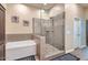Modern bathroom with a glass enclosed shower, separate tub, and neutral tile at 19535 E Via De Olivos Rd, Queen Creek, AZ 85142
