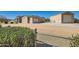 Spacious property featuring a detached garage, large driveway and mature landscaping at 19535 E Via De Olivos Rd, Queen Creek, AZ 85142