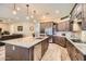 Spacious kitchen boasts a large island with stone countertops at 19535 E Via De Olivos Rd, Queen Creek, AZ 85142