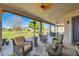 Inviting covered patio with comfortable seating, a ceiling fan, and a heater for year-round outdoor enjoyment at 19535 E Via De Olivos Rd, Queen Creek, AZ 85142