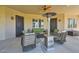Cozy covered patio with comfortable seating and a patio heater, perfect for enjoying the outdoors year-round at 19535 E Via De Olivos Rd, Queen Creek, AZ 85142
