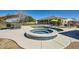 Beautiful backyard pool and spa with a tranquil design, surrounded by ample lounging space and lush landscaping at 19535 E Via De Olivos Rd, Queen Creek, AZ 85142