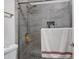Modern bathroom featuring stylish gray tiled shower with glass door at 2025 E Campbell Ave # 114, Phoenix, AZ 85016