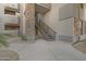 Condominium exterior featuring rock facade and stairwell access to upper units at 2025 E Campbell Ave # 114, Phoenix, AZ 85016