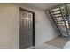 Front door to unit featuring stairs and a gravel garden at 2025 E Campbell Ave # 114, Phoenix, AZ 85016