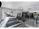 Well-equipped gym with treadmills, elliptical machines, and weight training equipment at 2025 E Campbell Ave # 114, Phoenix, AZ 85016