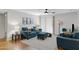 Open-concept living room with modern decor, hardwood floors and a sliding glass door to the patio at 2025 E Campbell Ave # 114, Phoenix, AZ 85016