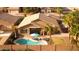 Aerial backyard shot featuring a sparkling pool with lounge chairs and a privacy wall, perfect for relaxation at 203 W Raven Dr, Chandler, AZ 85286