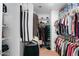 Organized walk-in closet with ample shelving and hanging space for clothes and accessories at 203 W Raven Dr, Chandler, AZ 85286