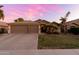 Beautiful home exterior showcasing a spacious driveway, desert landscaping, and a welcoming entryway at 203 W Raven Dr, Chandler, AZ 85286