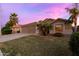 Lovely home featuring a well-manicured lawn, a two-car garage, and inviting curb appeal at 203 W Raven Dr, Chandler, AZ 85286