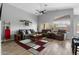 Bright living room with high ceilings, lots of natural light, and comfortable neutral furniture at 203 W Raven Dr, Chandler, AZ 85286