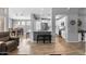 Open-concept living space with view of kitchen, dining nook, and comfortable seating area at 203 W Raven Dr, Chandler, AZ 85286