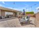 Expansive backyard with sparkling pool, elegant lounge, and ambient string lights for outdoor enjoyment at 20340 E Camacho Rd, Queen Creek, AZ 85142