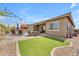Beautiful backyard with a pool, pavers, an outdoor seating area, and artificial turf at 20340 E Camacho Rd, Queen Creek, AZ 85142