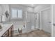 Bright bathroom with tile floors, a soaking tub, and a separate glass shower for convenience at 20340 E Camacho Rd, Queen Creek, AZ 85142