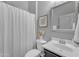 Bright bathroom features a shower with white curtain, stylish mirror and dark vanity at 20340 E Camacho Rd, Queen Creek, AZ 85142